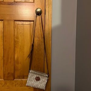 Michael Kors crossbody bag. White with tan MK lettering.